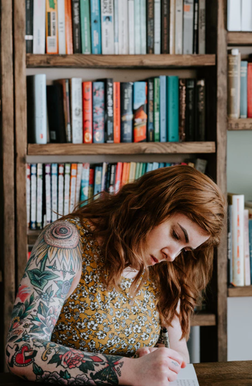 girl-with-tattoo-in-a-library